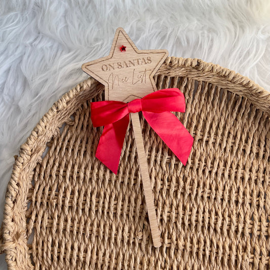 ‘On Santas nice list’ star wand with bow
